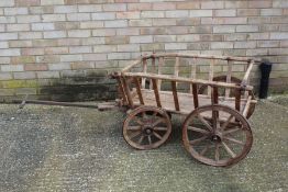 Rustic wooden wagon, with four wheels and carriage, 67cm wide