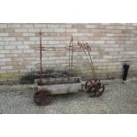 Novelty wooden and wrought iron plant stand, with four iron wheels