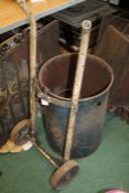 Oil Barrel sack barrow, together with a blue oil barrel with central tap (2)