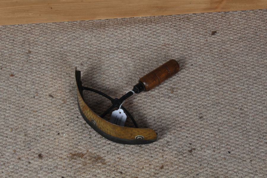 G. Deakin, of Sheffield, wooden handled and brass horse sweat scraper, 23cm high