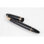 Montblanc Meisterstuck No. 146 fountain pen, the polished black body with gilt bands and 14 carat