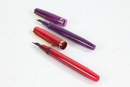 Two Conway Stewart 570 'Dinkie' fountain pens, in red and purple lumina (2)