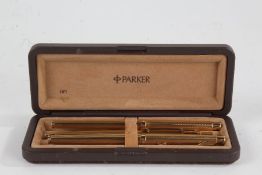 Parker three piece gold plated pen set, comprising of two fountain pens and a ballpoint pen, in