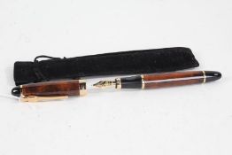 Jinhao fountain pen, the brown marble effect body with gilt mounts and 18ct gold nib