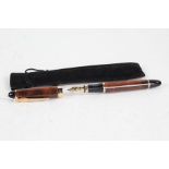 Jinhao fountain pen, the brown marble effect body with gilt mounts and 18ct gold nib