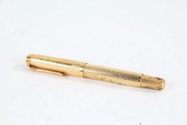 Pelikan gold plated fountain pen, with engine turned decoration, with 14ct gold nib