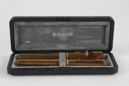 Parker gold plated two piece pen set, comprising fountain pen with 18ct gold nib and a ballpoint, in