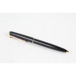 Montblanc ballpoint pen, the black body with gilt mounts and lever mechanism