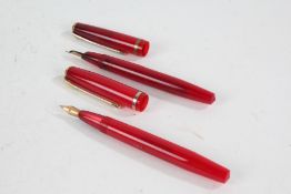 Two Conway Stewart 570 fountain pens, each with red bodies (2)