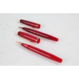 Two Conway Stewart 570 fountain pens, each with red bodies (2)
