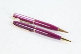 Two Conway Stewart 'Dinkie' 54 propelling pencils, with purple lumina cases (2)