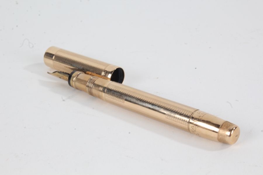 Mabie Todd 'Swan' 14 carat gold cased fountain pen, with 14 carat gold nib