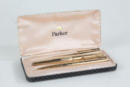 Parker 12ct rolled gold three piece pen set, comprising fountain pen, ballpoint and propelling