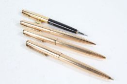 Parker - two 12ct rolled gold ballpoint pens, a matching propelling pencil, and one other