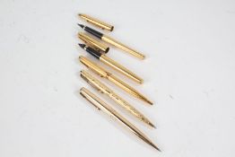 Parker - five various gold plated pens, to include two fountains, two ballpoints and one