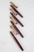 Three Parker fountain pens, each with 12ct rolled gold lids and maroon cases, and one other with 14k