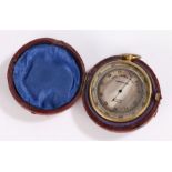 Dollond pocket barometer, with silvered dial, gilt brass case and housed within the leather case