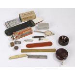 Collection of items, to include a brass advertising rule, penknife, a brass dice, The Concinnum