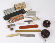Collection of items, to include a brass advertising rule, penknife, a brass dice, The Concinnum