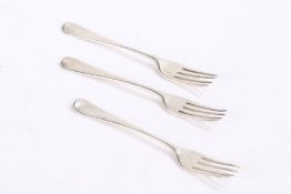 Pair of George III silver dessert forks, London 1810, similar dessert fork, London 1814, with Old