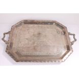 Silver plated tray, with scroll cast handles and canted corners, the central field with scroll