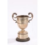 George VI silver twin handled trophy cup, Dublin 1948, maker J.S, on an ebonised and white metal