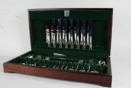 Canteen of Butler plated table cutlery, place settings for eight, housed in a green velvet lined