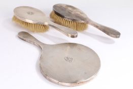 George VI silver dressing table set, London 1947, maker TP, consisting of hand mirror and two