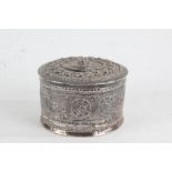 Indian white metal circular pot and cover, of cylindrical form, the embossed top with animal and