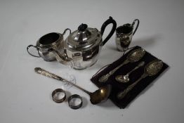 Pair of silver napkin rings, 0.6oz, plated ware to include three piece tea set, cased serving spoons