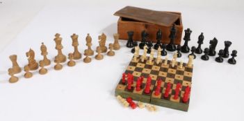 Early 20th Century travel folding chess board and set, with bone and red stained pieces, together