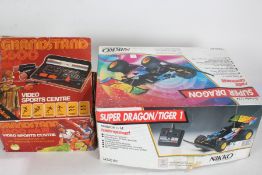 Nikko Super Dragon remote control car, XGO Offroad Tiger remote control truck, Grandstand 3600 MKIII