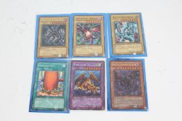 Yu-Gi-Oh! cards, to include a Blue-Eyes White Dragon 1st Edition SKE-001, a Thousand Dragon 1st