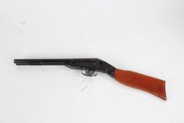 Tin plate sawn off shotgun, with wooden stock, 52cm long