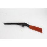 Tin plate sawn off shotgun, with wooden stock, 52cm long