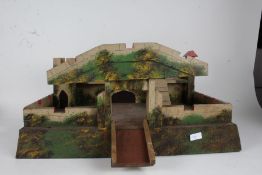 Model fort, castle and garage, together with a collection of figures to include cowboys and indians,