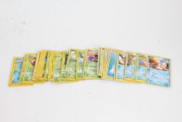 Collection of Pokemon cards, to include Ivysaur 47/110, Ekans 46/62, Staryu 103/144, and others,
