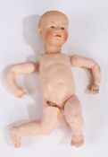 German Heubach Koppelsdorf bisque headed doll, stamped to the back of the head, with jointed body