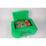 KNEX model building set, housed in a green plastic travel case