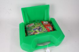 KNEX model building set, housed in a green plastic travel case