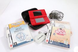 Nintendo DS Lite in red, together with Dr Kawashima's Brain Training, My Word Coach, More Brain