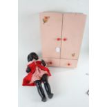Mid 20th Century Pedigree doll, wearing a red dress, together with a miniature painted wardrobe,