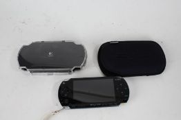 Sony PSP console, Logitech plastic case (2)