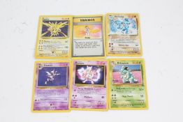 Pokemon TCG, to include a Holo Zapdos 16/102, Mewto 3, Holo Machamp 8/102, Haunter 21/62,