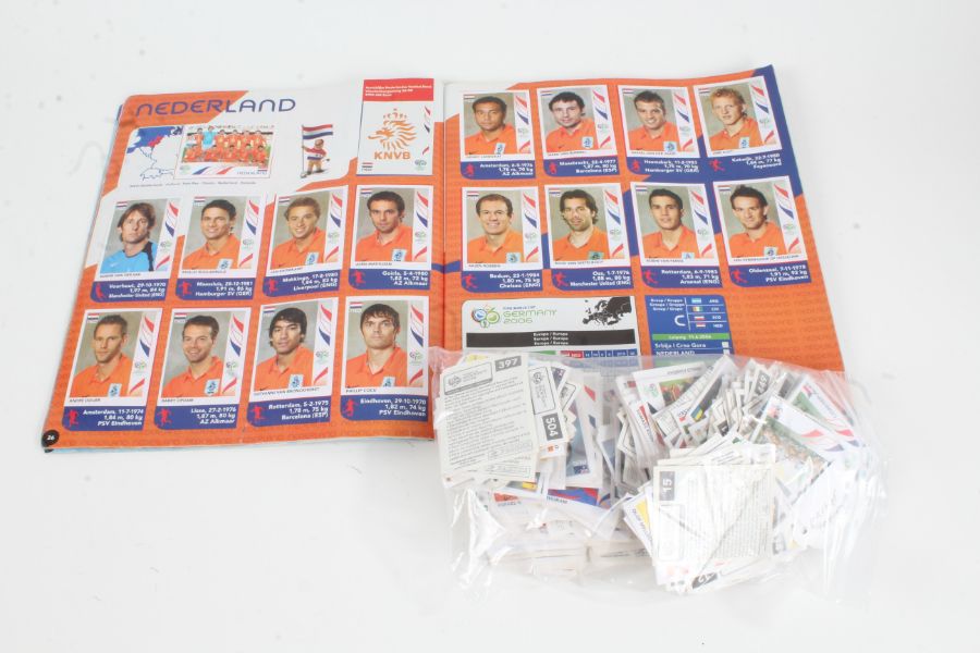 Panini 2006 World Cup Germany complete sticker album, together with a quantity of loose cards