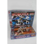 Four boxed sets of Robotix, R4000 Argus, R2030 Bront, R740 Lunax, R40 Motorpack (4)