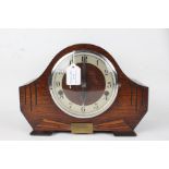 Art Deco style oak mantel clock, the arched case with engraved line decoration and brass