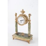 20th century onyx and brass portico clock, having white dial with black Roman numerals, mounted with
