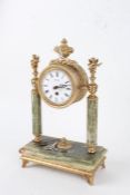 20th century onyx and brass portico clock, having white dial with black Roman numerals, mounted with