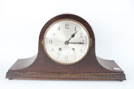 1920's/30's oak cased mantel clock, the dial with Arabic numerals, twin train movement, 43cm wide